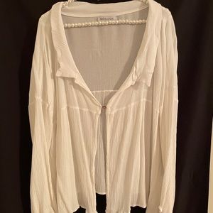 White, blouse with one button closure. Very cute